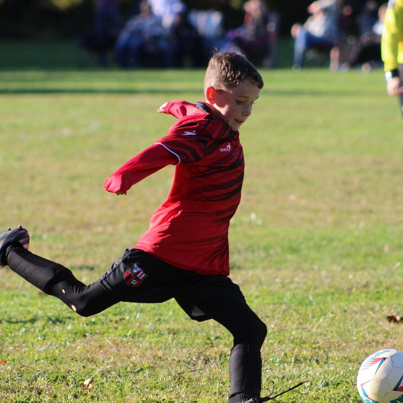 Youth soccer player practicing shooting technique during finishing class at JP Palumbo Soccer Academy